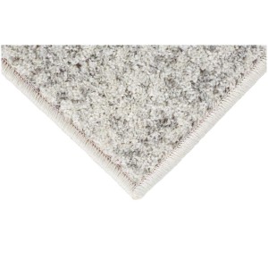 Dettaglio del tappeto Andiamo Bolonia color crema-grigio, moderno tappeto tessuto con motivo.