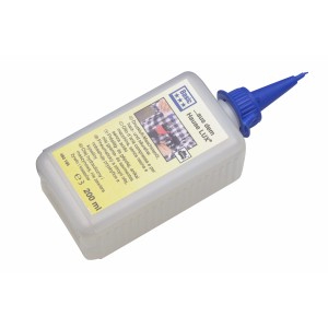Huile pour machines pneumatiques LUX, flacon de 200ml avec bouchon à vis bleu.
