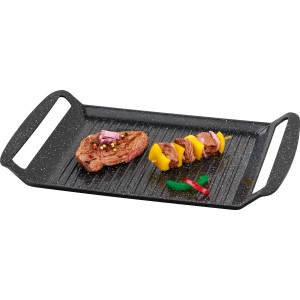 Griglia da tavolo a induzione ITG 1130 con bistecca e spiedino di verdure sulla superficie di cottura.
