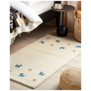 Tapis Gabbeh Yali en laine beige clair avec motif bleu et marron, 80x150 cm.