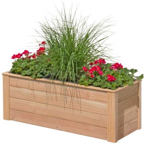 Jardinière en mélèze avec 3 inserts, plantée de géraniums rouges et d'herbe ornementale.