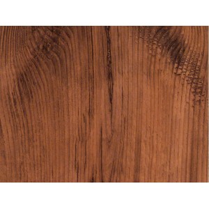 Gros plan : revêtement de sol stratifié brun foncé décor pin moka avec grain de bois.