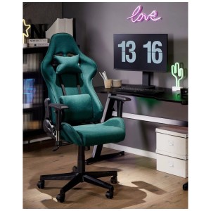Sedia da gaming verde Beliani Warrior con cuscini per collo e lombari davanti alla scrivania.