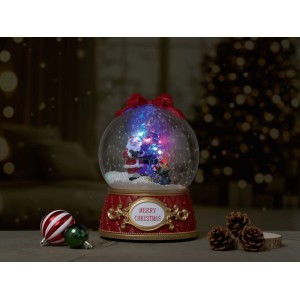 Boule à neige musicale OBI avec éclairage LED multicolore, Père Noël, sapin et inscription 'Merry Christmas' sur base rouge.