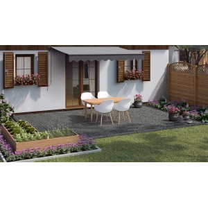 Pavés en basalte gris (9x9 cm) posés sur une terrasse avec mobilier de jardin.