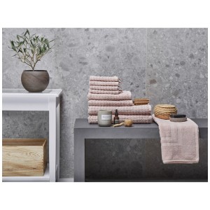 Set de serviettes Beliani Atai, 9 pièces, rose, en coton, avec serviettes, serviettes d'invités, draps de bain et tapis de bain.
