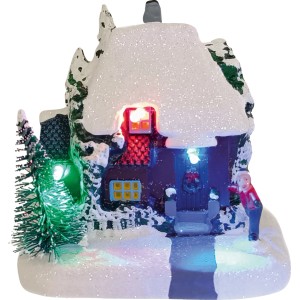 Village de Noël illuminé avec maison enneigée, sapin et figurine. Décoration multicolore en plastique pour table et rebord de fenêtre.
