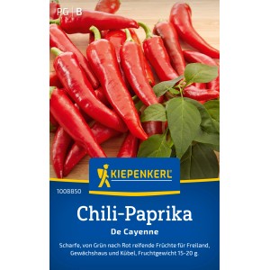 Poivrons rouges forts Cayenna Kiepenkerl sur bois.