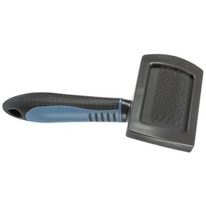 Brosse douce en plastique Trixie, 10x17 cm, pour un entretien doux du pelage des chiens.