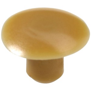 Cache en plastique beige Hettich à enfoncer dans les trous de perçage de 6 mm.
