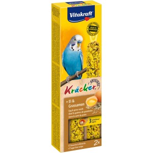 Vitakraft Kräcker uovo e semi di prato per cocorite, 2 pezzi. Bastoncini da rosicchiare in scatola gialla.