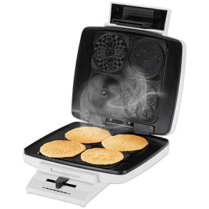 Trisa Brezeleisen Classique bianco con Bretzeli appena sfornati. Piccolo elettrodomestico da cucina con rivestimento antiaderente.