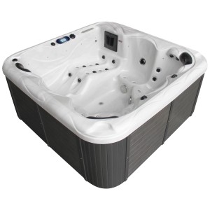 Spa extérieur blanc Sonnenkönig Sansibar avec habillage gris et jets de massage.