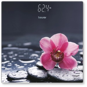 Pèse-personne en verre Beurer Relax GS215 avec motif floral et affichage digital.