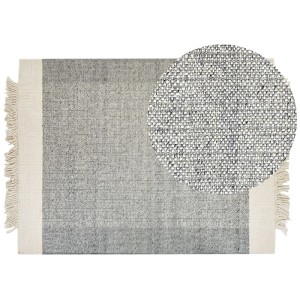 Tapis gris Beliani Tatlisu en laine (140x200 cm) avec franges et vue détaillée de la texture.