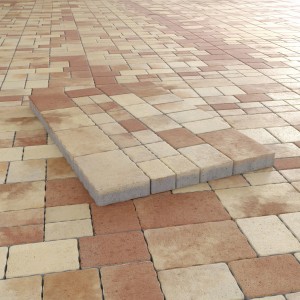 Pavé multi-format Encanto béton antique terra-nuancé, motif de pose avec différentes pierres de pavage.