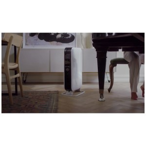 Radiateur à huile blanc Mill Gentle Air WiFi 2000W dans un salon. Chauffage électrique avec contrôle via l'application.