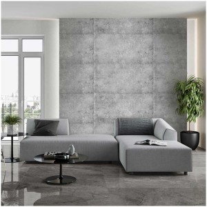Salon avec panneaux de plafond Decorate gris foncé aspect béton au mur.