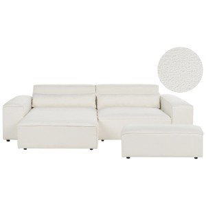 Canapé d'angle Beliani Hellnar blanc crème avec revêtement bouclé, ottoman et coussins.