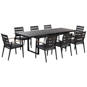 Set da pranzo Beliani Valcanetto/Taviano nero per esterni con tavolo allungabile e 8 sedie con cuscini grigi.