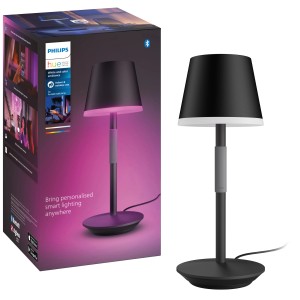 Schwarze Philips Hue Go Tischleuchte mit Farbwiedergabe und Verpackung.
