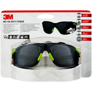 Lunettes de protection 3M Solus 1000 emballées, avec verres gris et accents verts.
