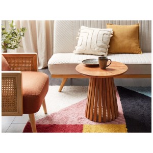 Table basse Beliani Mesilla en acacia, marron, ronde avec base en bois ajourée.