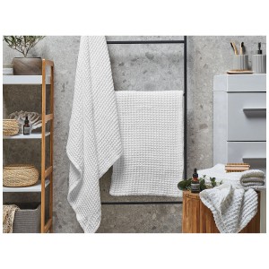Ensemble de 4 serviettes de bain Areora en coton blanc avec texture gaufrée.