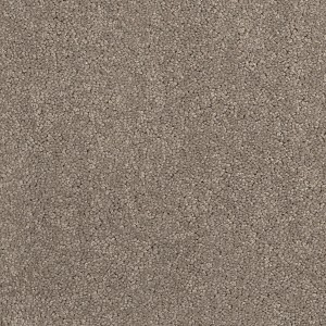 Gros plan d'un revêtement de sol en moquette beige Andiamo Feliz en fibres, vendu au mètre.