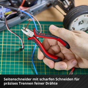 Pince de précision Einhell en utilisation : Coupe précise de fil avec une pince coupante du set d'outils 8 pièces.