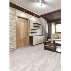 Gres porcellanato grigio Opera Quarzite 30x60 cm posato in soggiorno con effetto pietra naturale.