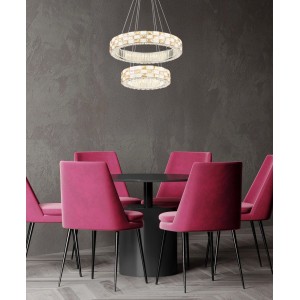 Suspension LED Globo Lidia chromée avec cristaux en verre, hauteur réglable, au-dessus d'une table à manger.