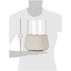 Climaqua Belly M, candeliere da tavolo in cemento con cilindro in vetro, altezza circa 29 cm.