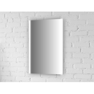 Specchio luminoso rettangolare Jokey LTS-05 LED bianco (60x40 cm) con interruttore a levetta su parete di mattoni bianchi.