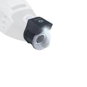 Modulo luce Dremel LM1 nero con luce LED accesa, fissato a un utensile multifunzione Dremel, per lavori precisi.