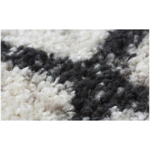 Dettaglio del tappeto Andiamo Bolonia color crema e grigio, moderno tappeto tessuto con motivo.
