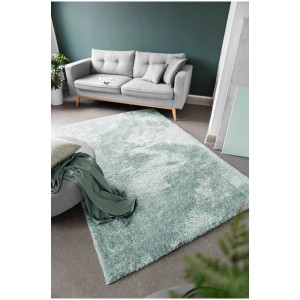 Tappeto a pelo alto turchese Gela (60x110 cm) in poliestere nel soggiorno. Tappeto moderno e soffice.