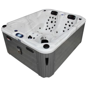 Spa extérieur Sonnenkönig Lanai blanc, bain à remous fixe avec habillage gris et cuve intérieure blanche.