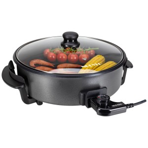 Padella per paella e scaldavivande Nouvel con coperchio in vetro, ripiena di verdure. Grill elettrico con rivestimento antiaderente.