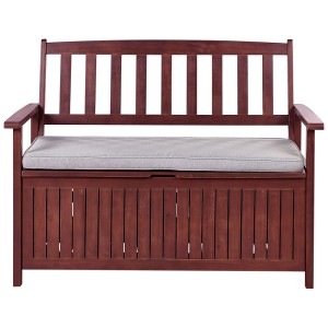 Banc de jardin Sovana rouge foncé avec coussin gris clair et rangement en acacia.