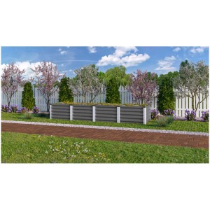 Aiuola rialzata in metallo Vitavia Linus 245x65cm in giardino con piante e recinzione bianca.