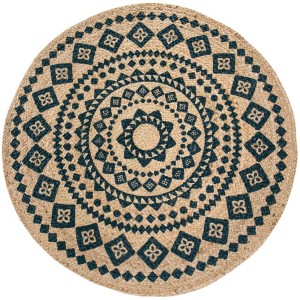 Runder Juteteppich Malo (Ø 80 cm) mit blauem Ornamentmuster.