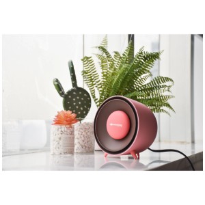 Radiateur céramique Sonnenkönig Bee Pink, un chauffage électrique rose et marron.