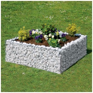 Jardinière surélevée en gabion carrée (40x120x120 cm) avec remplissage en pierre blanche et plantes dans le jardin.